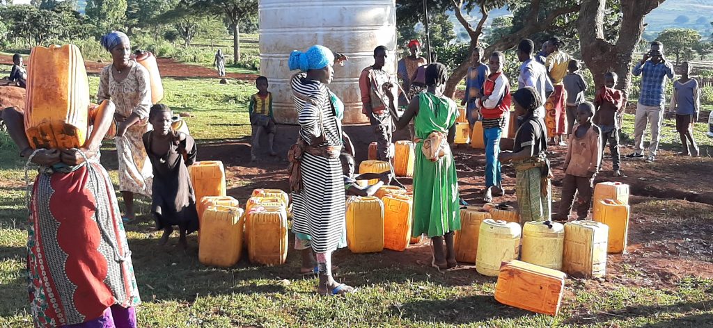 HareWenji ladies fetching borehole water